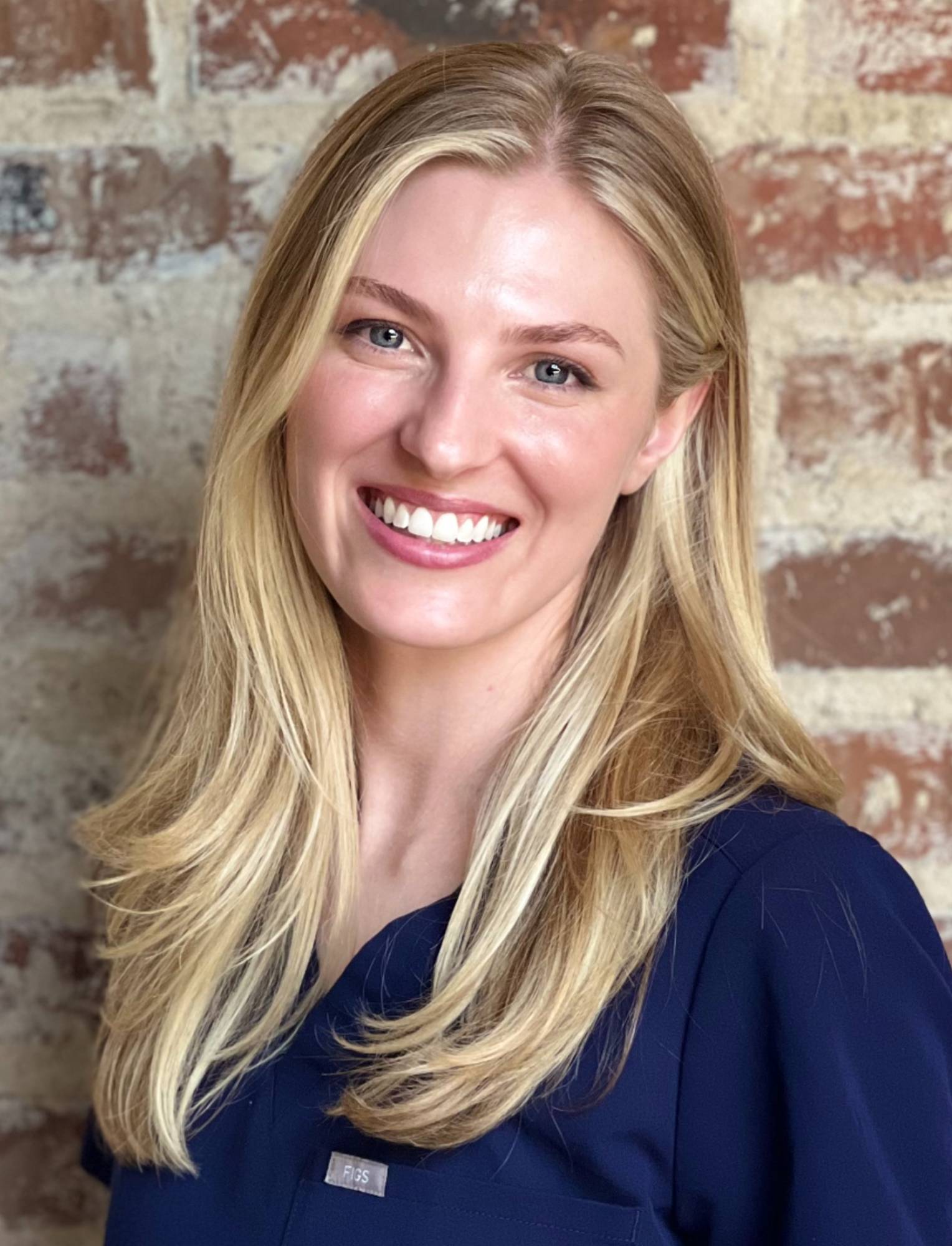 a woman smiling for the camera